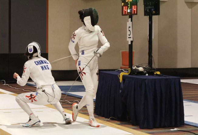Vivian Kong (right) and Natalie Chan compete in the final of the Challenge Cups Fencing Championships at Science Park. Photo: Shirley Chui
