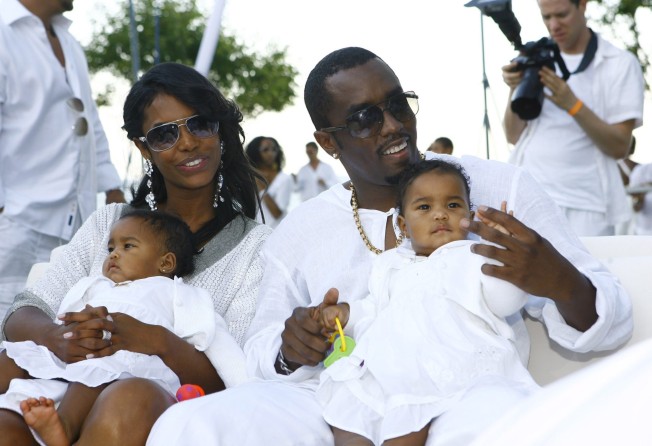 Sean Diddy Combs and Kim Porter with their twin daughters D’Lila Star Combs and Jessie James Combs, back in the day. Porter died in 2018. Photo: Getty Images