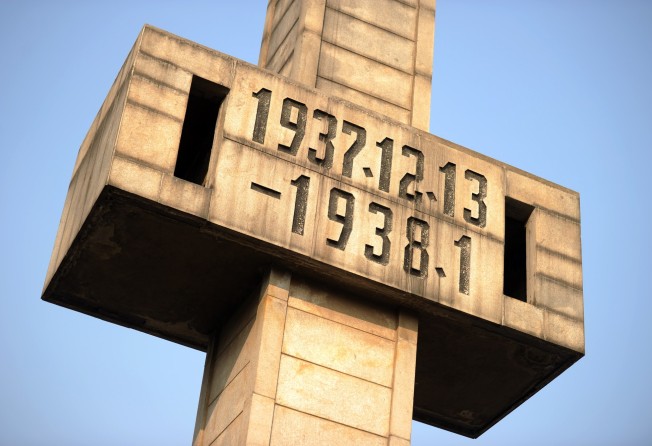 A giant cross with the dates of the massacre at a museum dedicated to the memory of the dead in Nanjing. Photo: AFP.