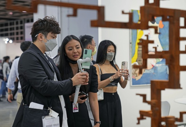 Visitors and staff at Art Basel Hong Kong 2022. Photo: AP