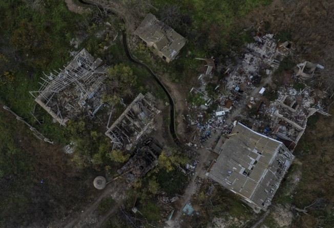A view of a Russian tank and destroyed buildings of a liberated village on the outskirts of Kherson, southern Ukraine. Photo: AP