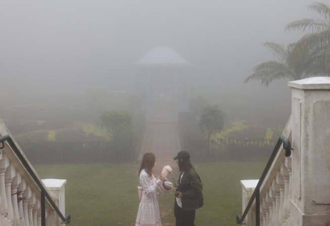 People visit the Peak Garden in Hong Kong, which is known for foggy weather. Photo: May Tse