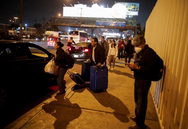 Passengers wait outside the airport after it was closed following a collision between a plane and a fire truck on the runway. Photo: Reuters