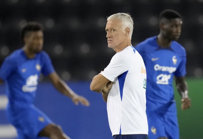 France’s national team coach Didier Deschamps supervises a training session at the Jassim Bin Hamad stadium in Doha, Qatar, Saturday, Nov. 19, 2022. France will play their first match in the World Cup against Australia on Nov. 22. (AP Photo/Christophe Ena)