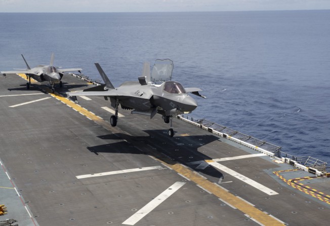 An F-35B Lightning II aircraft operated by the US Marine Corps lands on the amphibious assault carrier USS Tripoli in August. Photo: US Navy