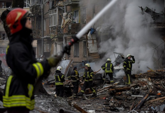 Firefighters work at an apartment block destroyed by shelling in Vyshhorod, near Kyiv on Wednesday. Photo: EPA-EFE