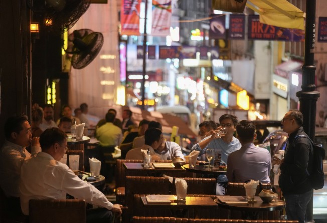 Customers gather in a bar at Lan Kwai Fong in Central. Photo: Sam Tsang