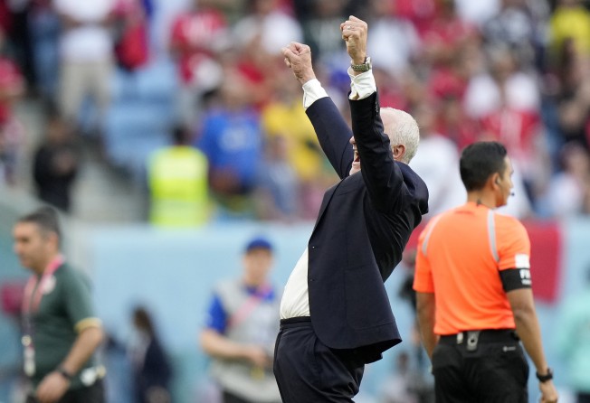 Australia’s head coach Graham Arnold celebrates after winning the World Cup group D match against Tunisia. Photo: AP
