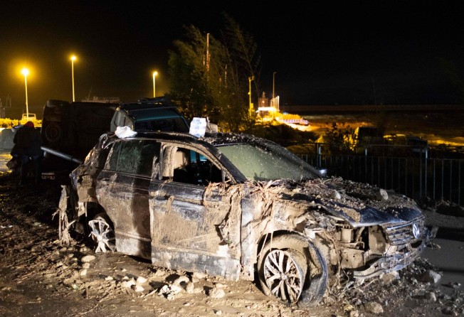 A damaged car following heavy rains that caused a landslide on Italy’s Ischia island on Saturday. Photo: AFP