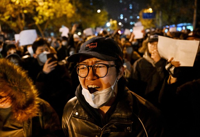 People in Beijing protest against China’s harsh Covid-19 restrictions on Monday. Photo: AFP via Getty Images/TNS