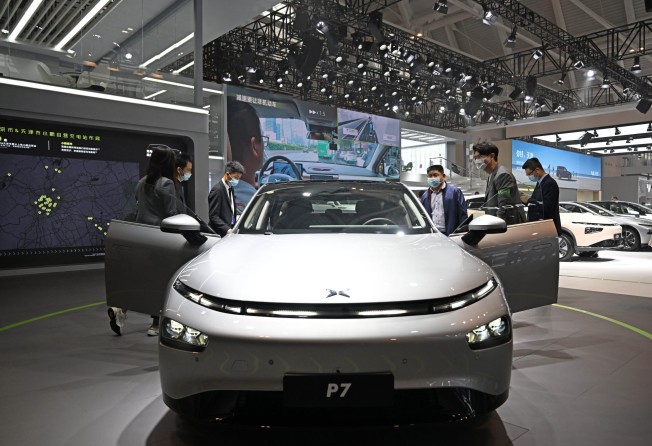 Visitors view a vehicle at the booth of Chinese electric automaker XPeng during the China Motor Show 2022. Photo: Xinhua