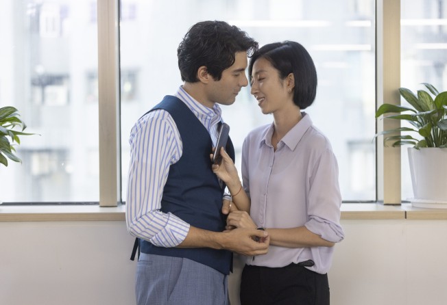 Kwai Lun-mei as Lin I-shan and Rhydian Vaughan as her boss (left) in a still from Women in Taipei. Photo: Disney+