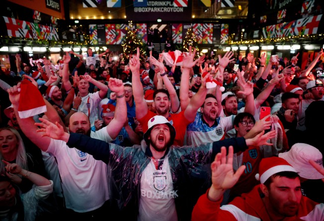 Fans gather in Croydon, London to watch England v Senegal on Sunday. Photo: Reuters