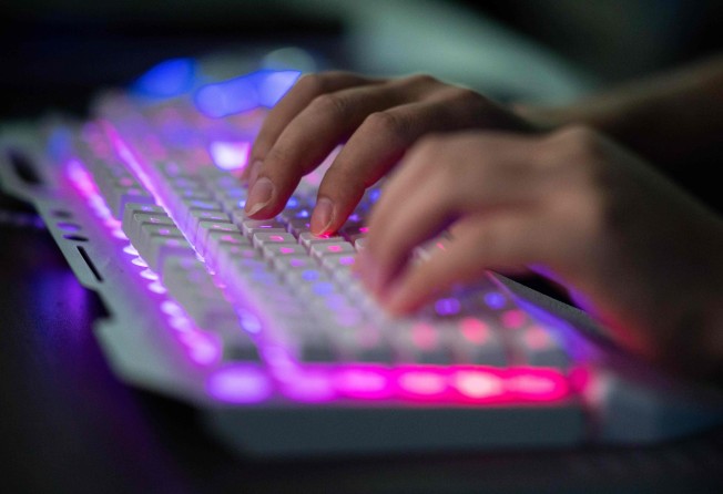A hacker on his computer in China’s Guangdong province in 2020. Photo: AFP