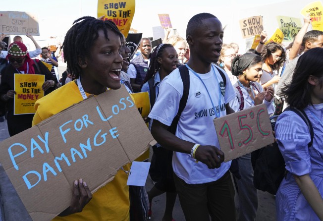 Vanessa Nakate (left) from Uganda participates in a Fridays for Future protest at the COP27 climate summit on November 11, in Sharm el-Sheikh, Egypt. The “loss and damage” fund agreed on at the summit is only putting salve on deep historical wounds. Photo: AP