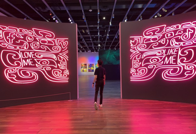 The entrance to Kongkee’s “Warring States Cyberpunk” exhibition at the Asian Art Museum, San Francisco. The pair of neon signs are based on the ancient Chinese symbol of Taotie. Photo: Asian Art Museum