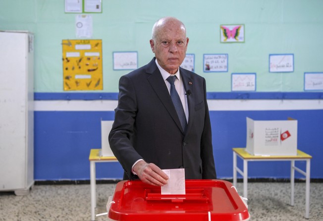 Tunisia’s President Kais Saied casts his ballot as he participates in legislative elections in Tunis on Saturday. Photo: AP