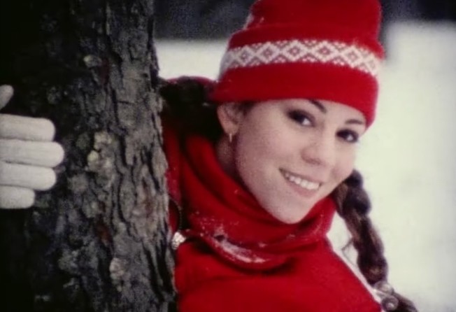 A quarter-century after releasing her holiday classic that’s become one of the season’s love-to-hate, hate-to-love clichés, Mariah Carey has finally pushed “All I Want for Christmas Is You” to top the charts for the first time. Photo: YouTube