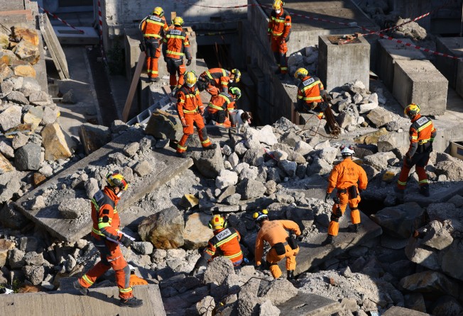 Rescue teams scour rubble for “victims”. Photo: Dickson Lee