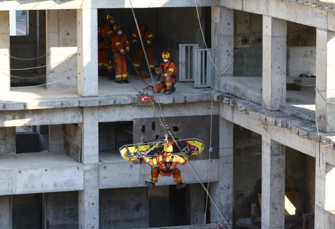 Hong Kong rescue teams simulate an urban extraction exercise. Photo: Dickson Lee