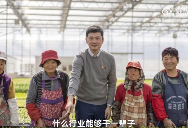 Huang Zhen with some of the farmers who work on his farm on Shanghai’s Chongming Island. Photo: Weibo