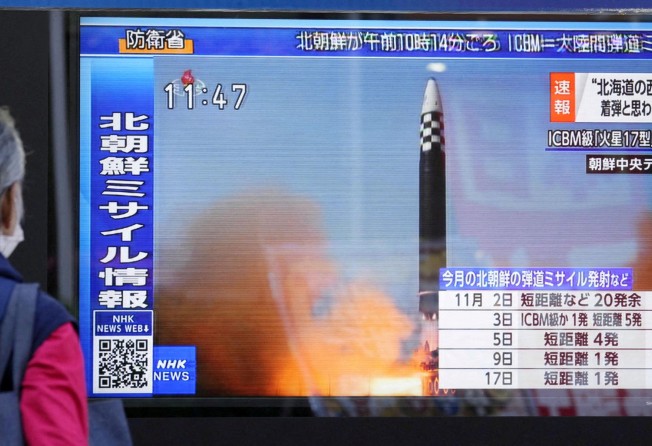 A television screen in Tokyo shows a news report about North Korea firing a ballistic missile on November 18, 2022. Photo: Kyodo via Reuters
