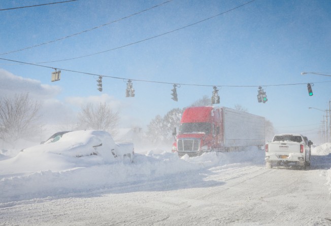 Vehicles left stranded on Main Street in Amherst, New York. Photo: Reuters