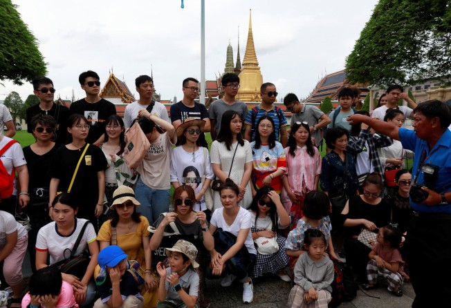 Chinese tourists at the Temple of the Emerald Buddha in Bangkok, Thailand in August 2018. Photo: Reuters