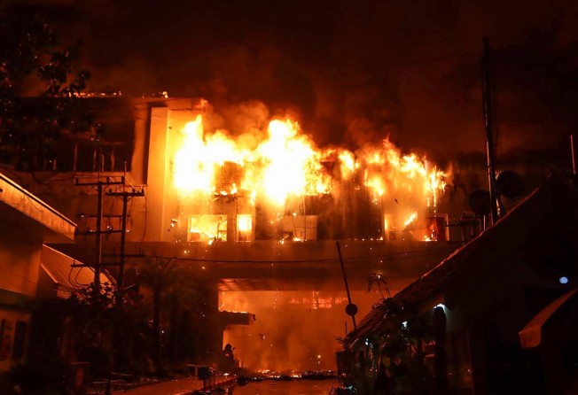 A major fire burns through the Grand Diamond City hotel-casino in Poipet. Photo: AFP