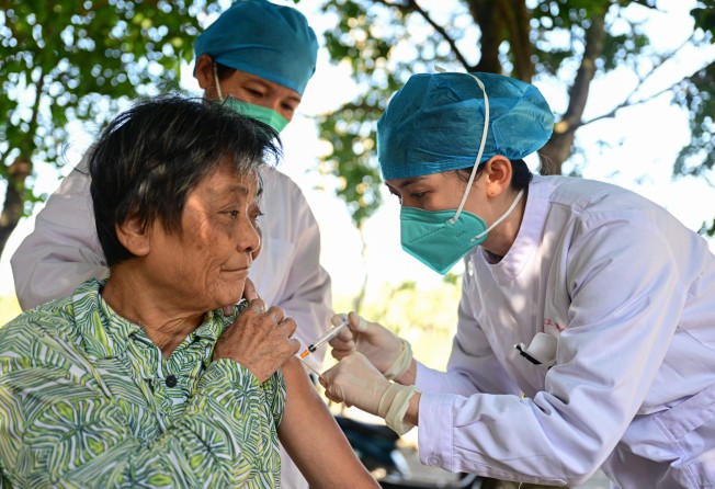 A medical worker administering a Covid-19 vaccine to a senior resident of Wenchang, Hainan province, on December 22. Photo: Xinhua