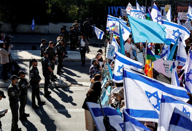 People protest outside Israel’s parliament on the day the new right-wing government is sworn in, with Benjamin Netanyahu as Prime Minister. Photo: Reuters
