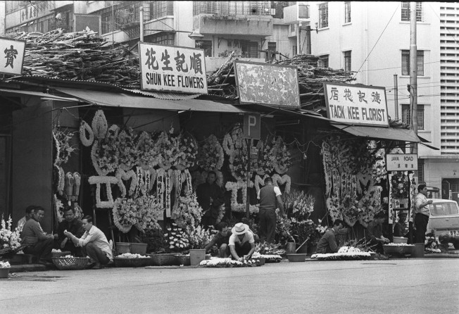 Florists selling flower wreaths for the dead near the Hong Kong Funeral Parlour in North Point. Photo: SCMP