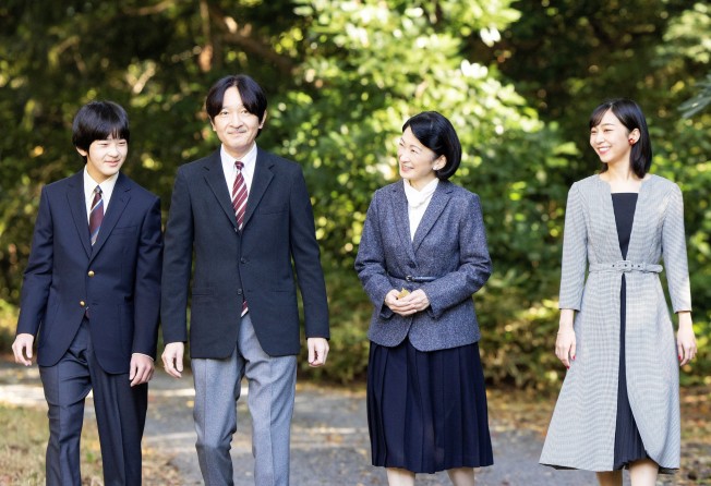Japan’s Crown Prince Akishino and Crown Princess Kiko, stroll with their son and daughter, Prince Hisahito and Princess Kako, at the Akasaka imperial property residence in Tokyo in November 2022. Photo: Imperial Household Agency via Reuters