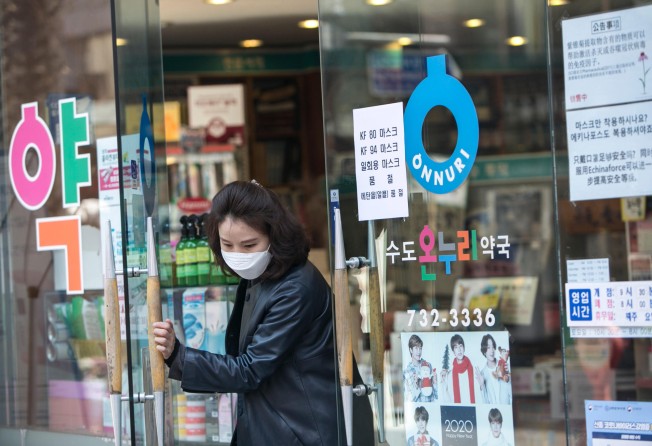 A customer leaves a pharmacy in Seoul, South Korea. File photo: Bloomberg