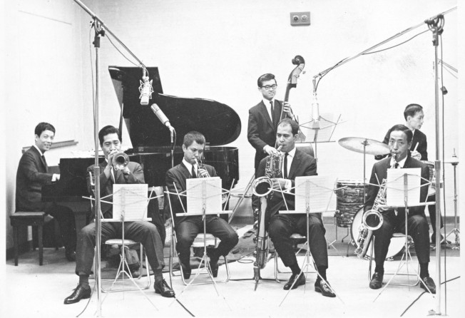 Joseph Koo plays the piano in a TVB studio with his band in 1969. Photo: SCMP