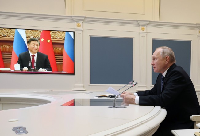 Presidents Xi Jinping and Vladimir Putin chat via video link on December 30. Photo: AP