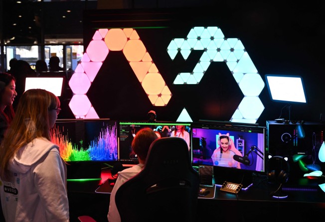 Razer Chroma lights are displayed above a computer station with accessories for video gaming and lifestyle content creation at the Razer Inc booth during the CES 2023 show in Las Vegas on January 6. Photo: AFP