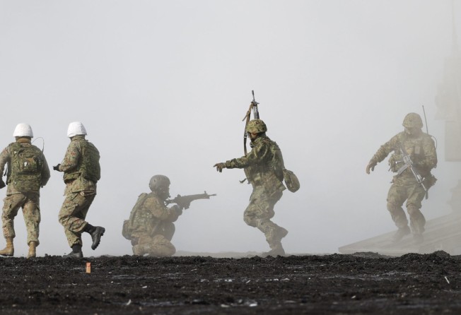Japanese soldiers and US marines take part in a joint amphibious exercise in Japan in March last year. Photo: Kyodo