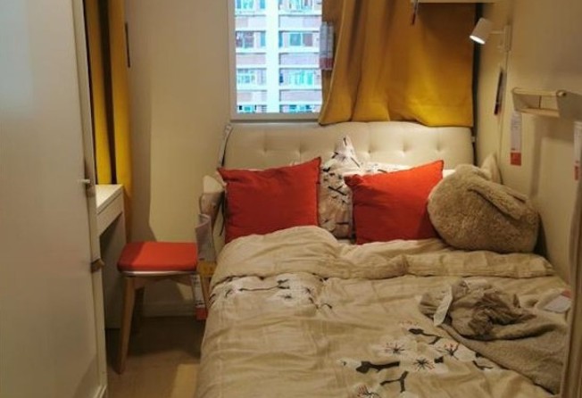 An IKEA bedroom display with the window view of a Hong Kong public housing estate. Photo: lihkg.com