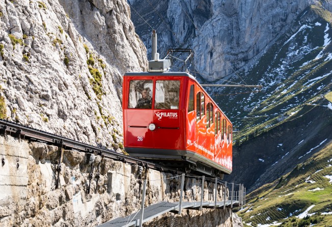 A cogwheel train climbs the steepest track in the world to the top of Mount Pilatus, in Lucerne, Switzerland. Photo: Shutterstock