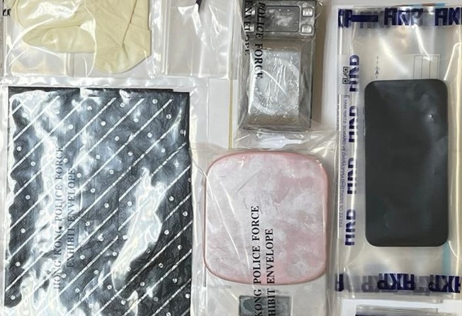 Police display the evidence they seized during a raid on a Hong Kong hotel room Monday. Photo: Handout
