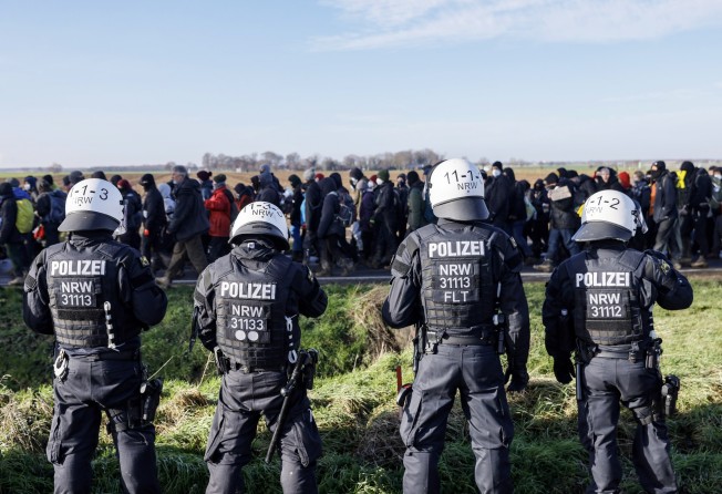 Police officers are seen at a rally by climate activists near the village of Luetzerath, Germany on Tuesday. Photo: EPA-EFE