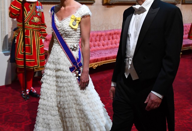 Catherine, Duchess of Cambridge and United States secretary of the treasury, Steven Mnuchin arrive through the East Gallery for a State Banquet at Buckingham Palace in June 2019, in London, England. Photo: Getty Images