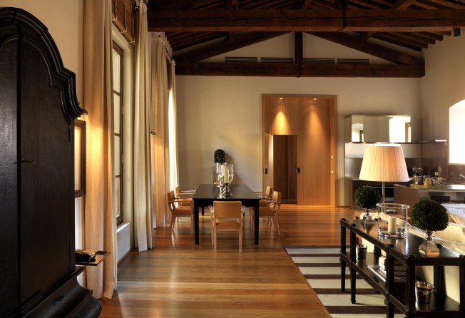 The living/dining room and kitchen of a residence at the Palazzo Tornabuoni in Florence. Photo: Massimo Listri