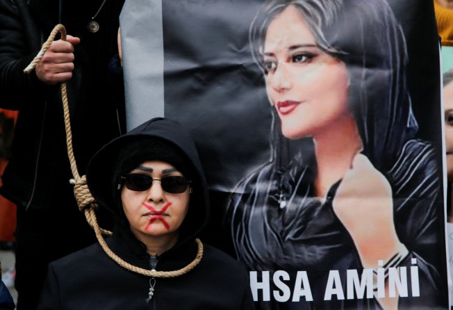 A woman takes part in a protest against the Islamic regime of Iran following the death of Mahsa Amini. Photo: Reuters