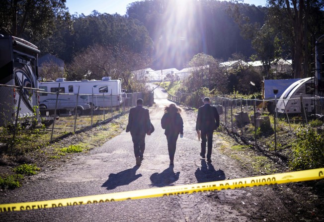FBI officials near Mountain Mushroom Farm, the scene of the shootings. Photo: AP