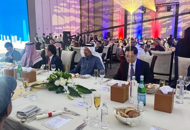 John Lee (right) at a gala dinner with Saudi representatives. Photo: Natalie Wong