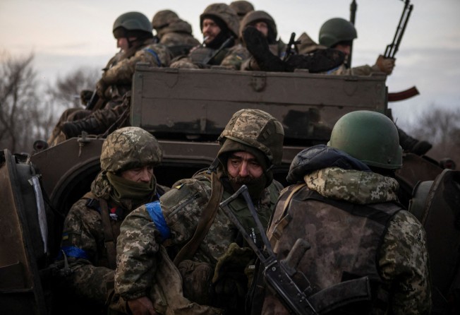 Ukrainian soldiers gather around an armoured vehicle outside Bakhmut during a Russian attack in Ukraine’s Donetsk region on February 11. Photo: Reuters