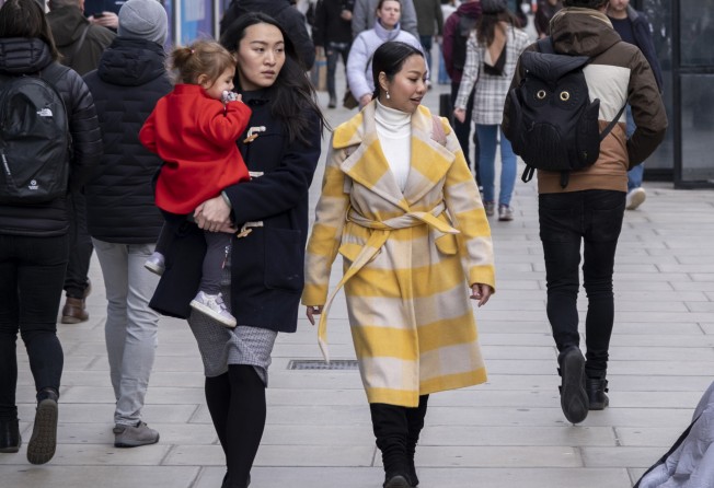 People on Oxford Street in London, January 2023. Even in the depths of winter, the British high street is a catwalk for a smorgasbord of looks. Photo: Getty Images