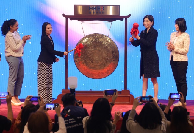 Kim-See Lim (second from left), regional director, east Asia and the pacific, International Finance Corporation; and Bonnie Chan (third from left), co-chief operating officer, HKEX host a gong-striking ceremony at Hong Kong Exchanges and Clearing on 8 March, 2023, as part of the global ‘Ring the Bell for Gender Equality’ campaign. Photo: May Tse
